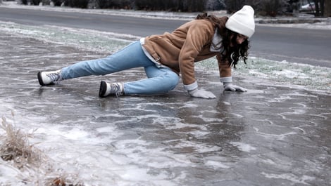 person slipping and falling on ice