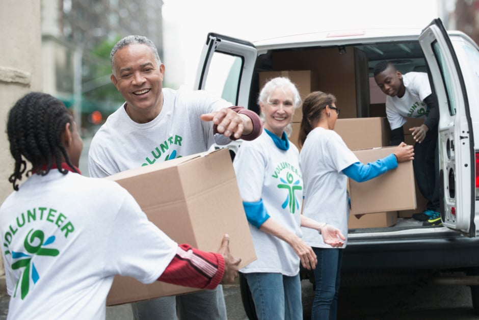 relief workers loading boxes into a van