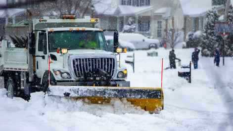 Snowplow operator plowing the streets