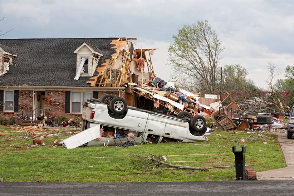 tornado damage with flipped over truck