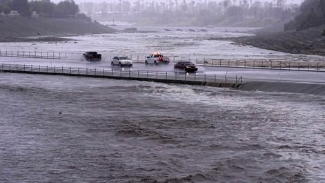 Cars surrounded by water due to flooding from Hurricane Hilary