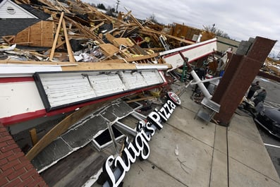 Employees salvage supplies and equipment from Luigi's Pizza, Sunday, Dec. 10, 2023, in Clarksville, Tennessee. Tornados caused catastrophic damage in Middle Tennessee, Saturday afternoon and evening. (AP Photo/Mark Zaleski)